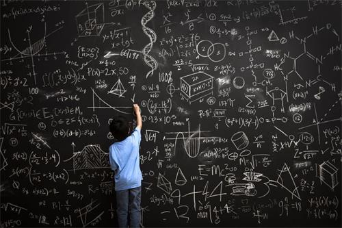 young-boy-writes-math-equations-on-chalkboard-168351254-5ad90020ba61770036501446.jpg